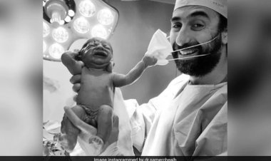 Viral Pic Of Baby Removing Doctor's Mask Becomes Symbol Of Hope