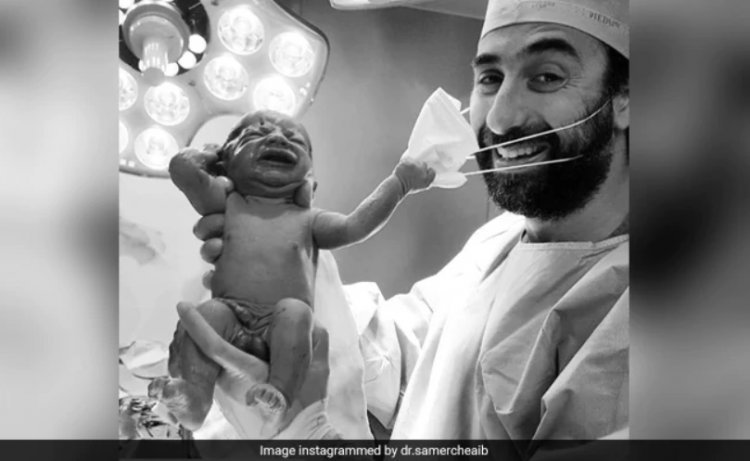 Viral Pic Of Baby Removing Doctor's Mask Becomes Symbol Of Hope